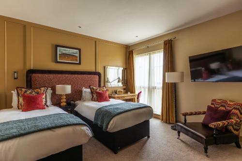 Postel nebo postele na pokoji v ubytování The Alma Hotel