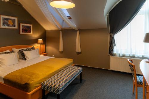 Ένα ή περισσότερα κρεβάτια σε δωμάτιο στο Hotel Piano