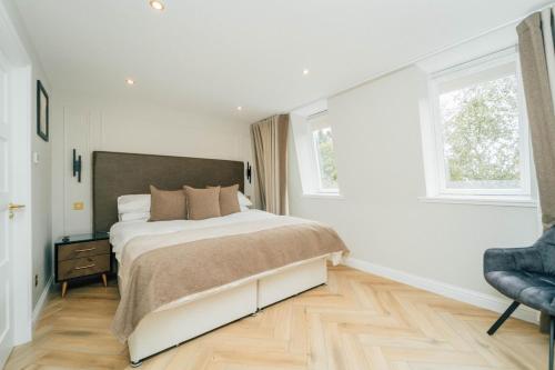 Ένα ή περισσότερα κρεβάτια σε δωμάτιο στο Eagleside Apartments