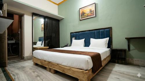 a bedroom with a large bed in a room at Nilaya in Varanasi