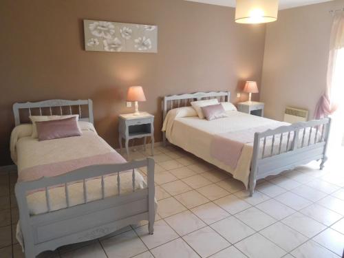 Postel nebo postele na pokoji v ubytování Le pastoral