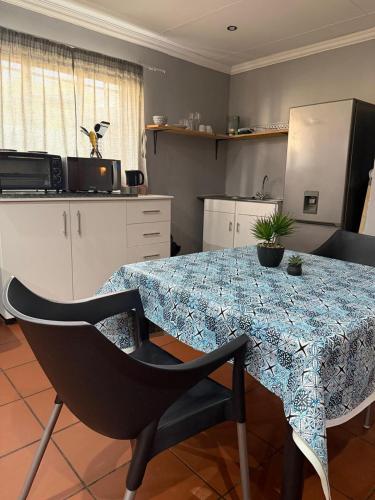 a kitchen with a table with a table cloth on it at 4 On Susanna in Kimberley