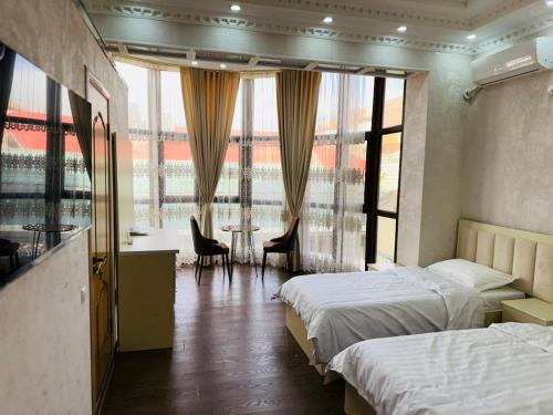 Ένα ή περισσότερα κρεβάτια σε δωμάτιο στο Soro Hotel