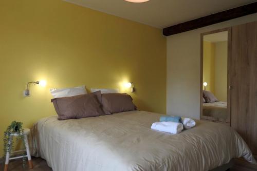 Postel nebo postele na pokoji v ubytování Graine