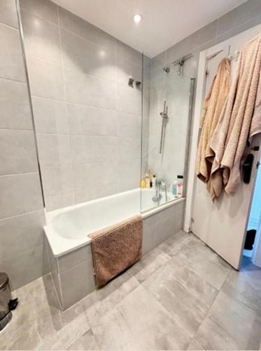 a bathroom with a bath tub and a shower at Pinos de Calahonda duplex in Sitio de Calahonda