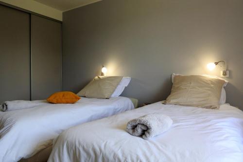 En eller flere senge i et værelse på Ficelle