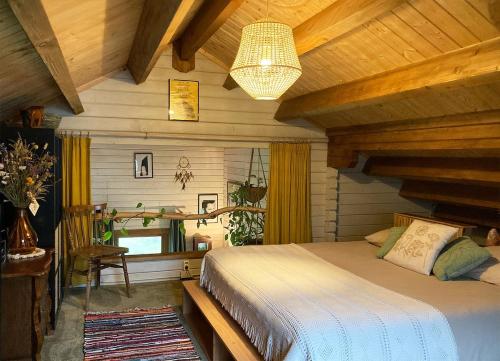 En eller flere senge i et værelse på De Cabin van Groenland