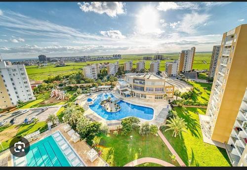 an aerial view of a building with a swimming pool at Caesar Resort SPA in Iskele