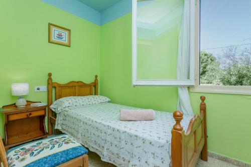 En eller flere senge i et værelse på Relax Apartamento