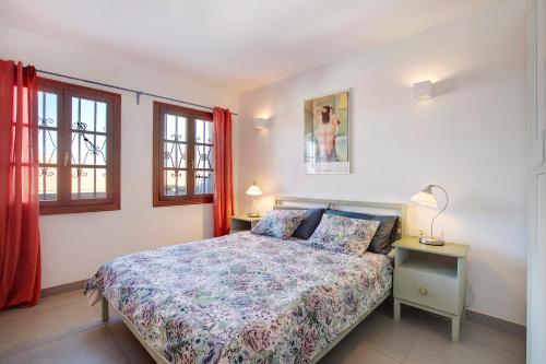 En eller flere senge i et værelse på Tenerife South Apartament