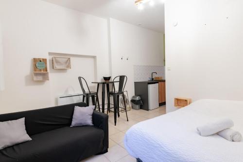 Postel nebo postele na pokoji v ubytování Le théâtre 2