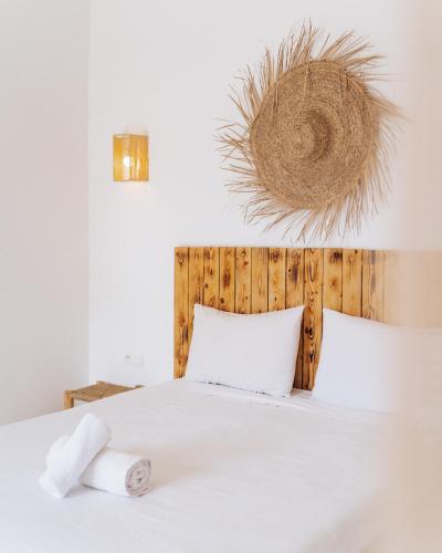 a bedroom with a bed with two towels on it at Igiwano guest house in Essaouira