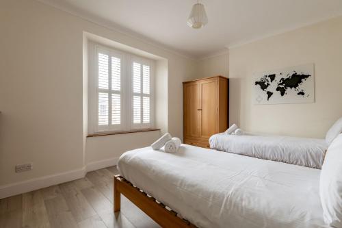 a bedroom with two beds and a window at Bonnington House - Elie in Elie