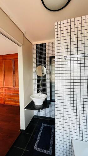 a bathroom with a sink and a mirror at Royal Guesthouse The Castle in Mtunzini