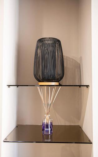 a glass shelf with a lamp on top of it at Tenuta San Nicola in Campobasso