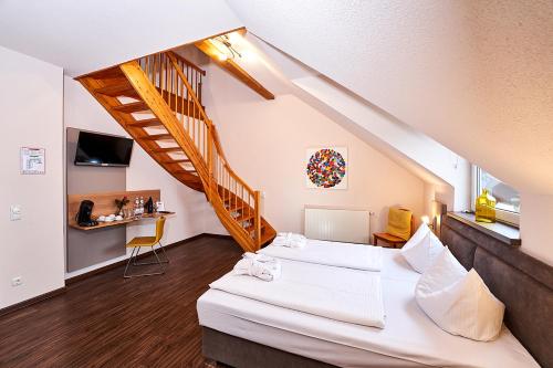 Ένα ή περισσότερα κρεβάτια σε δωμάτιο στο Brauers Landarthotel GmbH