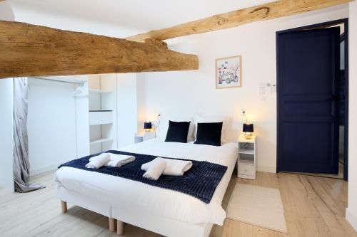 Ένα ή περισσότερα κρεβάτια σε δωμάτιο στο Confort & espace avec climatisation - T4 central