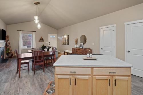 a kitchen and living room with a table and a dining room at Beaumont in Bend