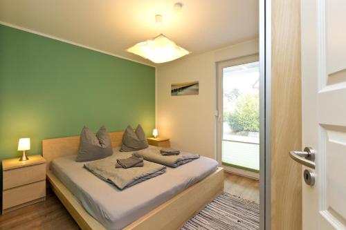 En eller flere senge i et værelse på Stieglitz Nest