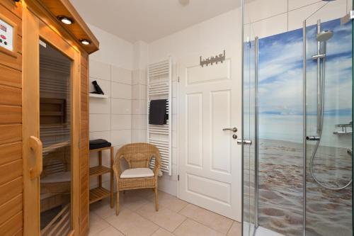 a bathroom with a shower and a glass door at Kiebitz in Röbel
