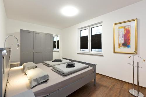 Ένα ή περισσότερα κρεβάτια σε δωμάτιο στο Am Hafen 3