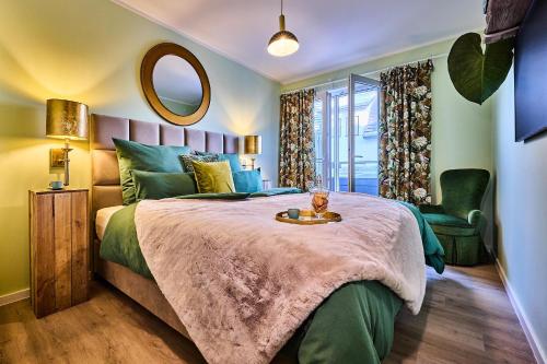 En eller flere senge i et værelse på Grüne Oase