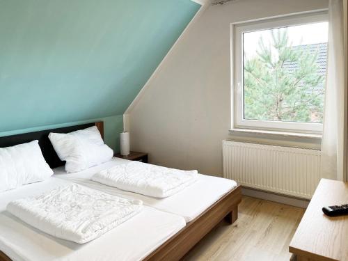 Ένα ή περισσότερα κρεβάτια σε δωμάτιο στο "Strandhaus" Unter den Kiefern 101