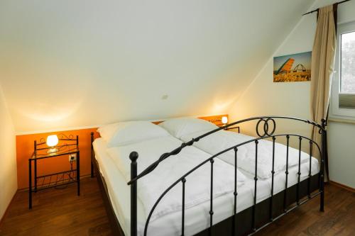 En eller flere senge i et værelse på Haus Pangea