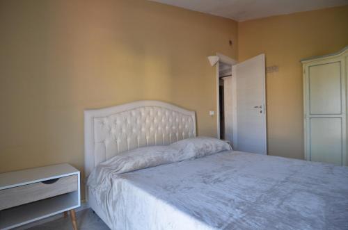 Ένα ή περισσότερα κρεβάτια σε δωμάτιο στο Villetta con giardino in contesto riservato non lontana dal mare BEL01