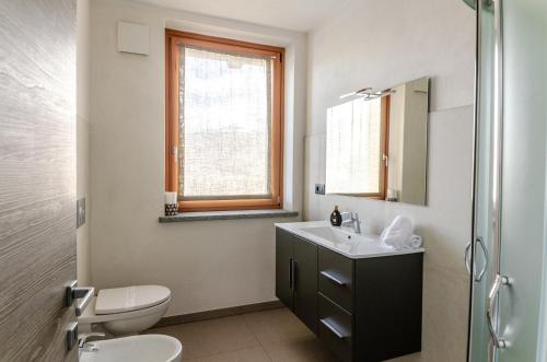 Et badeværelse på Aosta Holiday Apartments - Charvensod