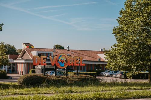 a blow up sign in front of a hotel at Camping de Vogel in Hengstdijk