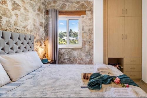 Ένα ή περισσότερα κρεβάτια σε δωμάτιο στο Gkountis Apartments Retreat