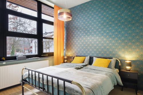 Ένα ή περισσότερα κρεβάτια σε δωμάτιο στο Black Forest Lodge