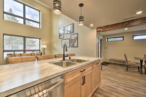 a kitchen with a sink and a living room at Luxury Red Lodge Retreat Hot Tub Downtown in Red Lodge