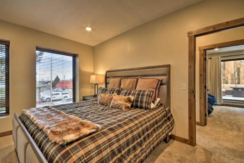 a bedroom with a bed with a dog laying on it at Luxury Red Lodge Retreat Hot Tub Downtown in Red Lodge