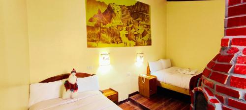 Postel nebo postele na pokoji v ubytování PLAZA cusco Amankay