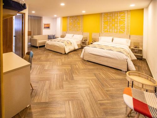 Ένα ή περισσότερα κρεβάτια σε δωμάτιο στο Nativo Hotel