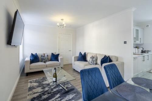 a living room with a couch and a table at Casa Fresa - 224 King St in Broughty Ferry