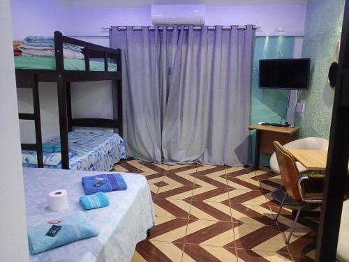 Ένα ή περισσότερα κρεβάτια σε δωμάτιο στο Pousada Recanto Dom Lázaro