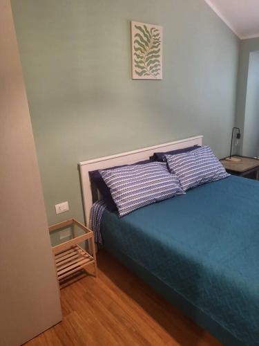 a bedroom with a bed with two pillows on it at Elegante Suite in Centro Torino · Self Check-in in Turin