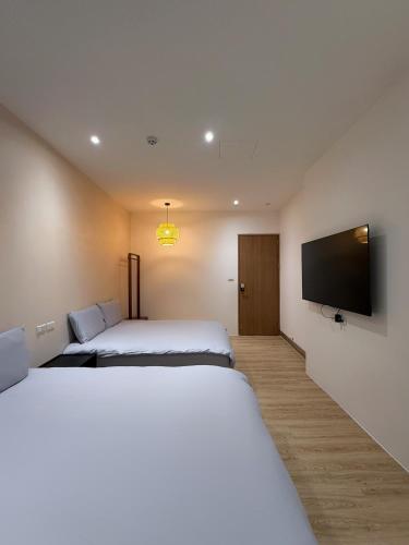 Ένα ή περισσότερα κρεβάτια σε δωμάτιο στο 浮生半盞 Ephemeral Stay