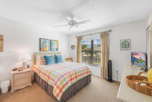 a bedroom with a bed and a window at San Marco Villas S-7 in Marco Island