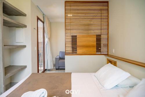 En eller flere senge i et værelse på Villa Makani no Shamballa by Qavi