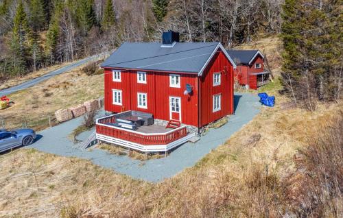 an aerial view of a red house on a hill at 2 Bedroom Stunning Home In Bjugn in Moen