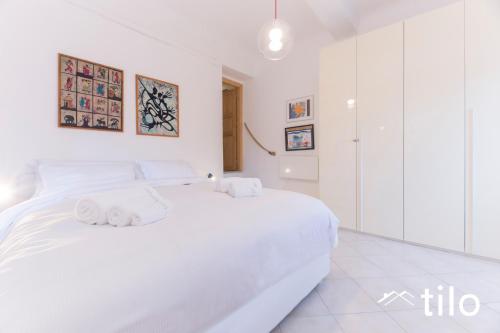 Un pat sau paturi într-o cameră la Beach 5M| 1BR| Wi Fi by Tilo