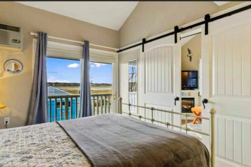 En eller flere senge i et værelse på Sand & Surf at Wells Beach