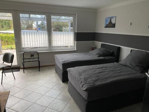 Ένα ή περισσότερα κρεβάτια σε δωμάτιο στο Adult only klimatisierte Ferienwohnung in Schwerte