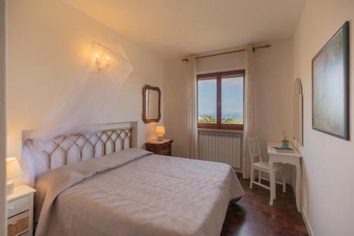 Postel nebo postele na pokoji v ubytování Appartamento Verde by ElbaSummer