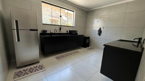 Køkken eller tekøkken på Casa Vila Muriqui