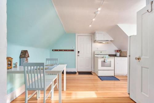 a kitchen with a table and chairs in a room at Capitol-Side • Downtown • Attic Harry-Potter Door in Cheyenne